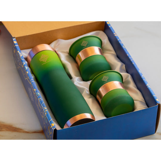Green silk finish copper bottle with matching glasses by Indian Art Villa, designed for stylish home displays.