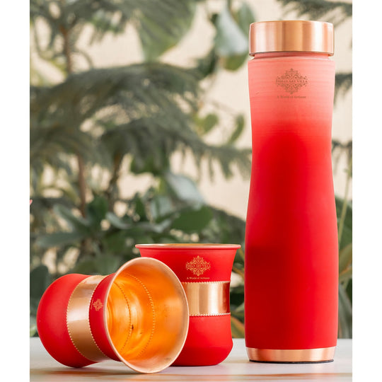 Stylish red ombre copper bottle set with matching glasses by Indian Art Villa, perfect for modern living and décor.