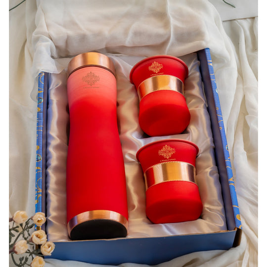 Stylish red ombre copper bottle set with matching glasses by Indian Art Villa, perfect for modern living and décor.