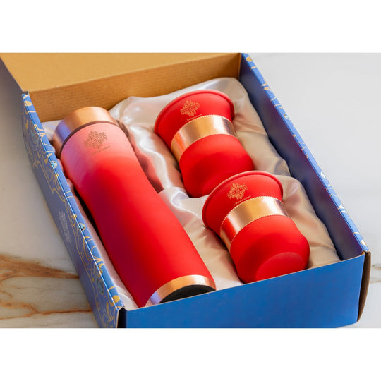 Stylish red ombre copper bottle set with matching glasses by Indian Art Villa, perfect for modern living and décor.