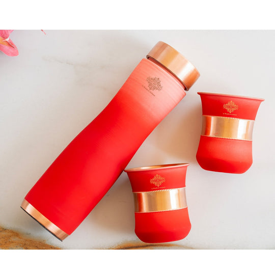 Stylish red ombre copper bottle set with matching glasses by Indian Art Villa, perfect for modern living and décor.