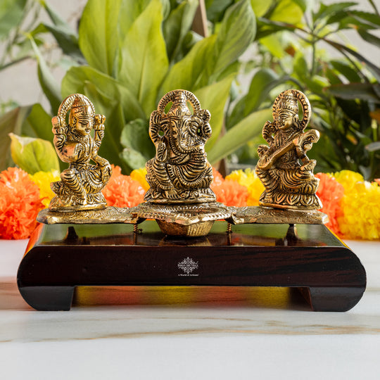 Brass Finish Ganesh Ji Laxmi JI & Saraswati Ji Murti On Wooden Base