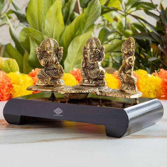 Brass Finish Ganesh Ji Laxmi JI & Saraswati Ji Murti On Wooden Base