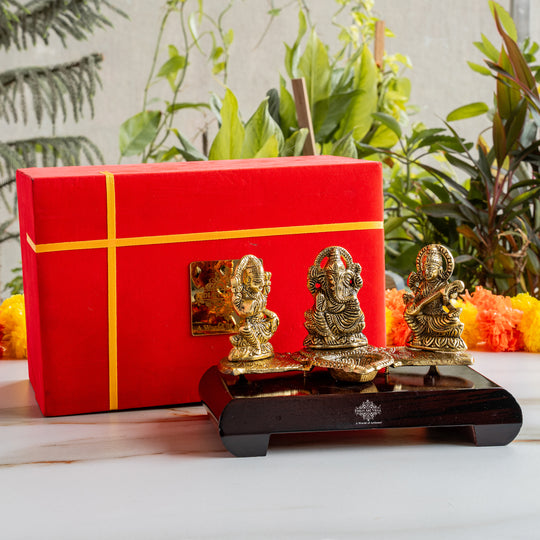 Brass Finish Ganesh Ji Laxmi JI & Saraswati Ji Murti On Wooden Base