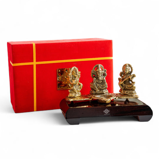 Brass Finish Ganesh Ji Laxmi JI & Saraswati Ji Murti On Wooden Base