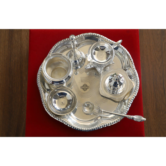 Indian Art Villa silver-plated pooja thali set with 9 accessories, a traditional religious gift item for festivals and rituals.