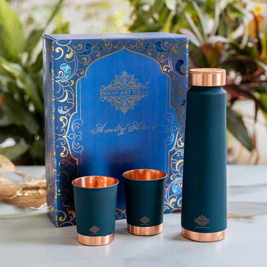 INDIAN ART VILLA matte finish dark teal copper bottle gift set with 2 copper glasses and ornate blue gift box.