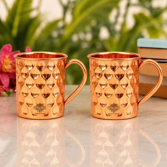 Traditional copper mug with decorative geometric diamond motifs