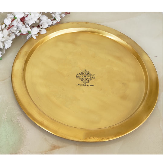 Elegant brass thali made from pure metal with a matte finish and circular shape reflecting artisanal workmanship