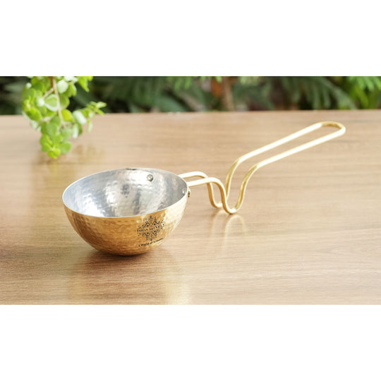 Hand finished brass tadka pan with hammered bowl long curved handle and tin coated inside ideal for making flavorful tadka