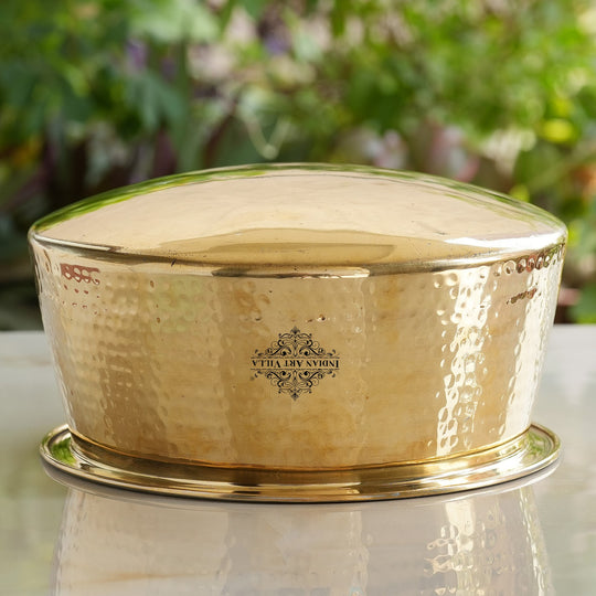 Classic hammered brass bhagona with reflective golden polish wide base two liter capacity and smooth inner tin lining layer
