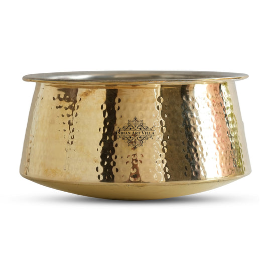 Hammered brass patila vessel with polished golden surface two liter rounded form wide top rim and silver tin lined interior