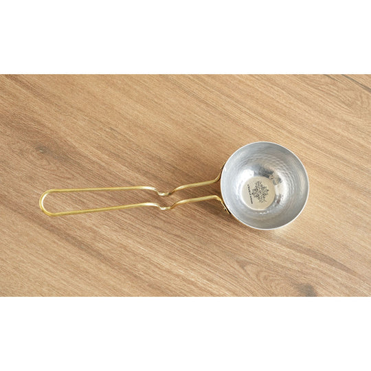 Durable hammered brass tadka pan with long sturdy handle polished finish and tin coated inside used for making tadka dishes
