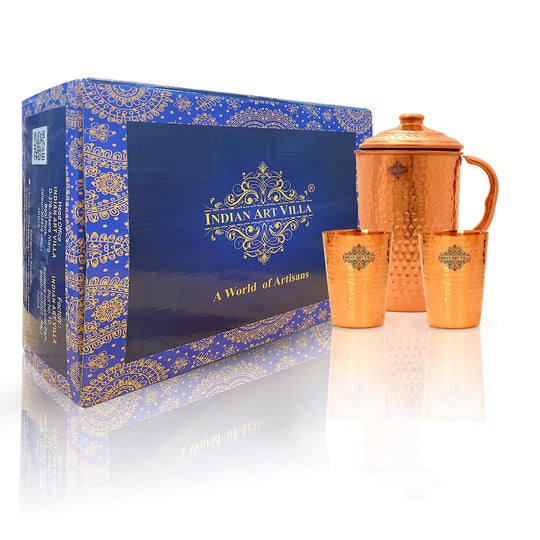 Indian Art Villa handcrafted copper drinkware set with a hammered finish, featuring a 1700ml jug and two 400ml glasses.