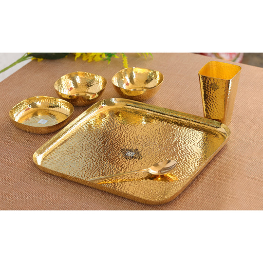 Indian Art Villa hammered brass dinner set with plate, bowls, glass, and spoon, perfect for traditional Indian dining.