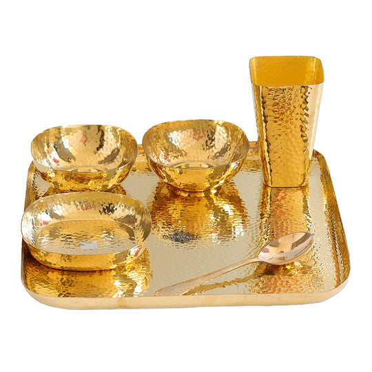 Indian Art Villa hammered brass dinner set with plate, bowls, glass, and spoon, perfect for traditional Indian dining.