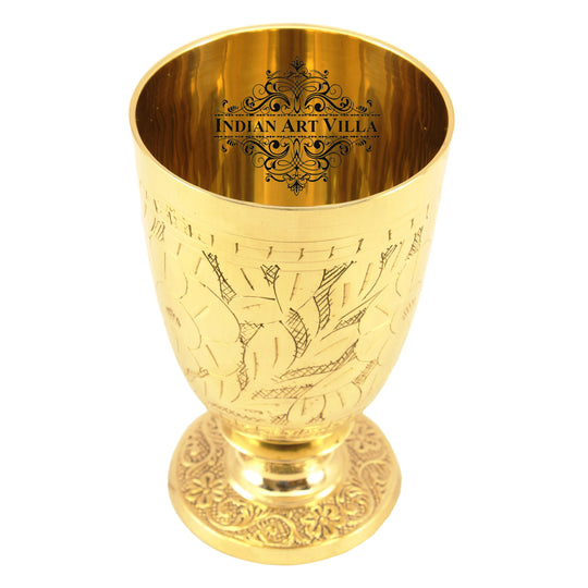 Ornate brass glass with pedestal stand and leaf etching available at Indian Art Villa for heritage style table decor
