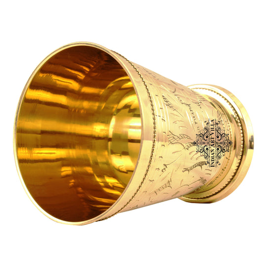 Brass glass with floral pattern designed for serving drinks and suitable for home kitchen dining or festive use