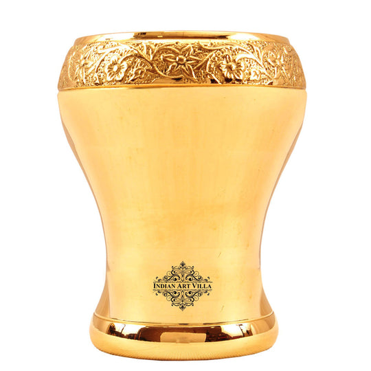 Elegant pure brass glass with curved Mughlai design featuring intricate floral detailing perfect for home decor or gifting.