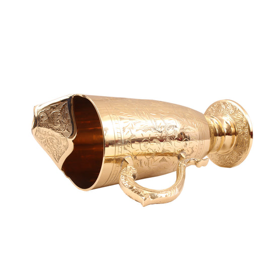 Traditional brass jug with ornamental kalamkari etching and handle ideal for gifting during spiritual celebrations
