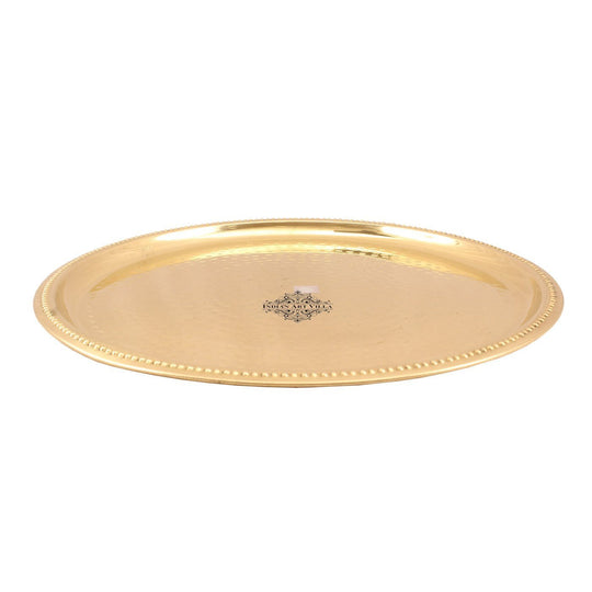 Round brass serving plate with hammered top and embossed edge handcrafted in polished finish by Indian Art Villa