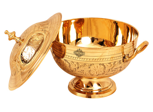 Indian Art Villa brass handi with floral engraving and lid, ideal for serving traditional Indian dishes in style.