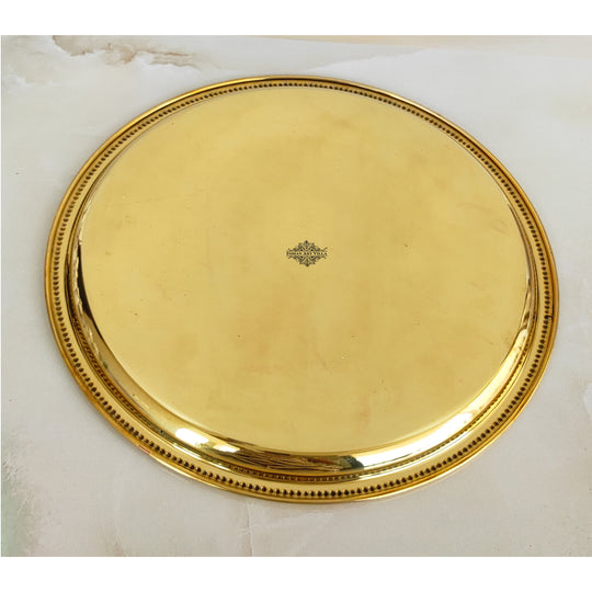 Indian Art Villa brass plate with deep golden shine and double ring floral design reflecting skilled Indian metalwork