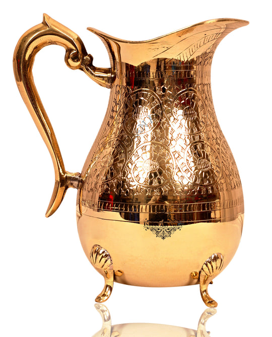 indian art villa pure brass pitcher with beautiful embossing four support legs and elegant antique finish
