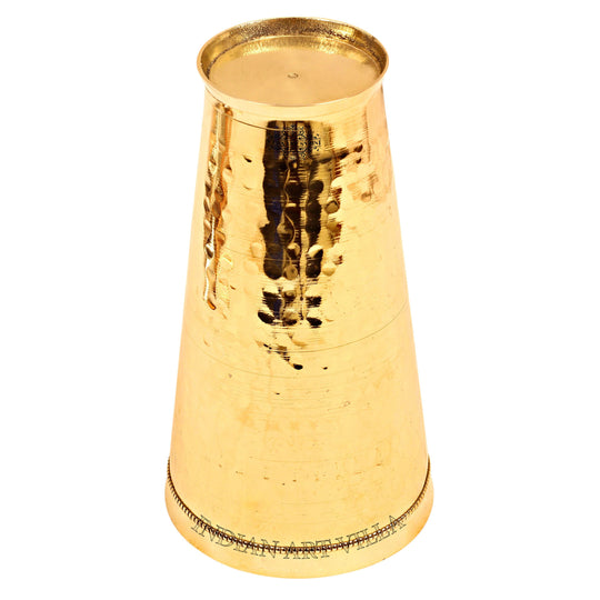 Classic brass tumbler for lassi with a hammered pattern, perfect for serving and other traditional beverages.