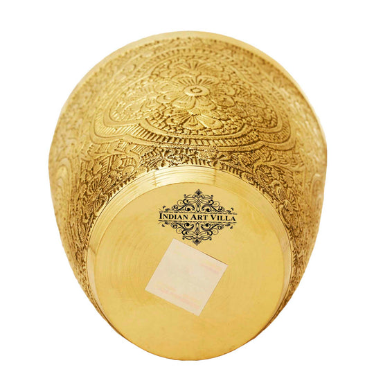 Brass tumbler with intricate floral carvings designed to bring timeless elegance and charm to drink presentation.