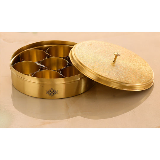 Handcrafted peetal masale ka dibba with engraved lid and seven spice compartments for Indian kitchen use