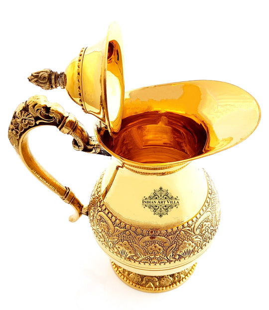 indian art villa presents an antique Pital jug with sculpted floral motifs beaded ring and royal style curved handle