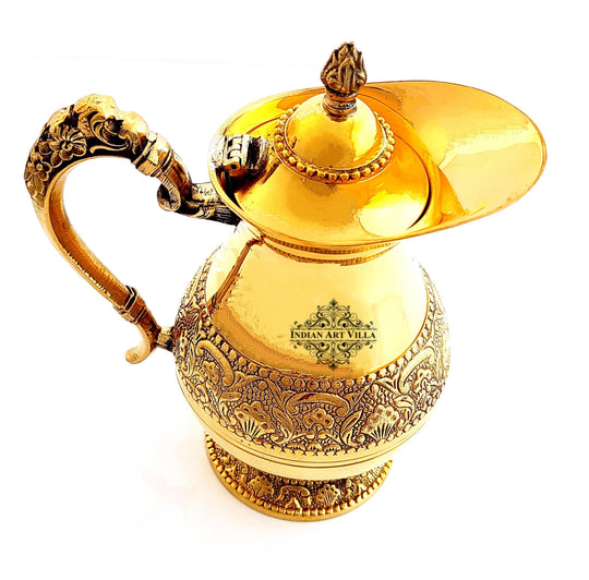 created by indian art villa this brass jug features a heavy base antique motifs and unique mughlai handle styling