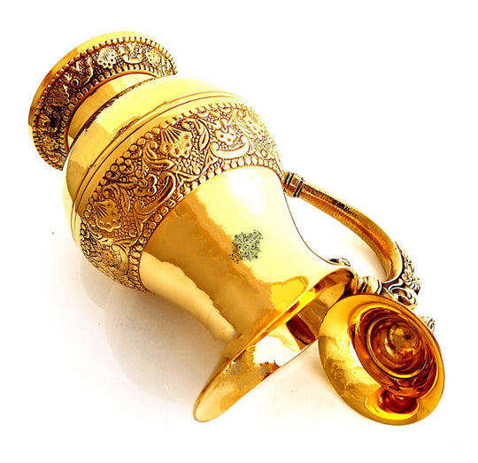 crafted by indian art villa this heritage style brass jug features sculpted handle embossed band and beaded top ring