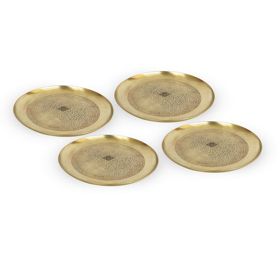 Elegant brass thali set with soft gold matte texture and ornate center engraving inspired by classical Indian metal art