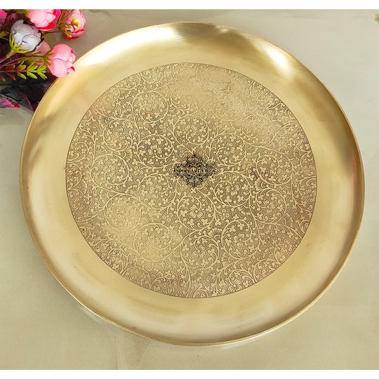 Indian Art Villa circular brass thali featuring matte brushed texture and intricate floral embossed inner pattern