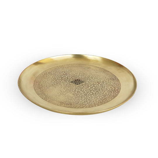 Round brass thali in matt finish with detailed center work by Indian Art Villa evoking warmth of handmade tradition