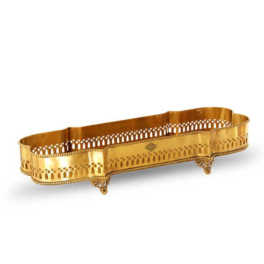 Indian Art Villa rectangular brass tray with four stylized base legs and open cut detailing around the upper border