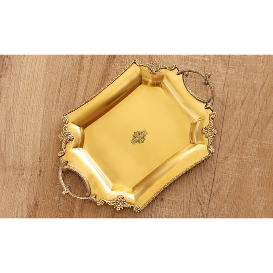 Pure brass platter crafted in soft matt finish with sculpted edge pattern and floral handles in a vintage inspired form
