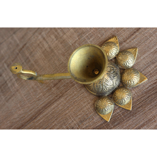 Brass aarti diya with deepak holders in a floral design, used for traditional Hindu rituals and puja ceremonies.