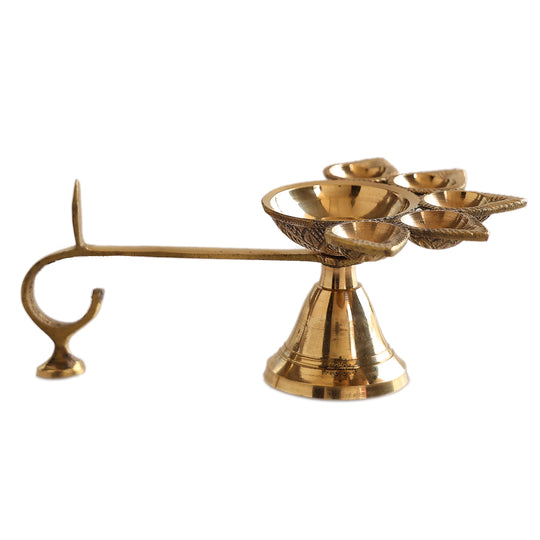 Brass aarti diya with deepak holders in a floral design, used for traditional Hindu rituals and puja ceremonies.