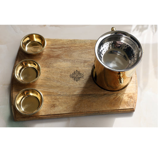 Handcrafted brass food warmer set from Indian Art Villa with three bowls a polished steel lid and a wooden base plate