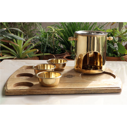 Decorative brass food warmer from Indian Art Villa featuring steel lid three brass bowls and a rustic wooden tray base