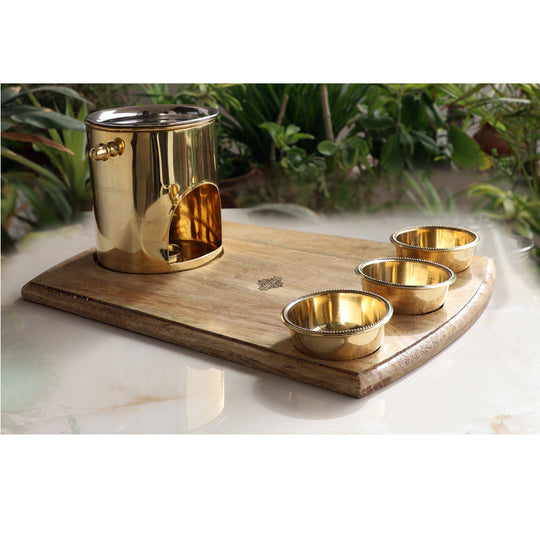Handcrafted brass food warmer used for stylish buffet serving in boutique hotels with wooden bottom and steel cover