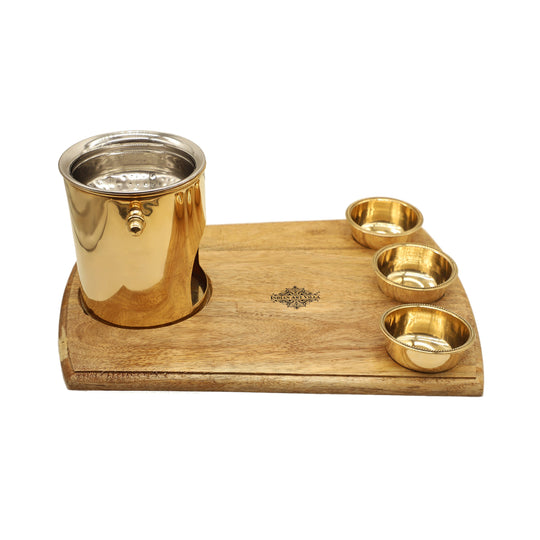 Indian Art Villa brass food warmer with steel lid and wood base used in catering or wedding setups for warm food service