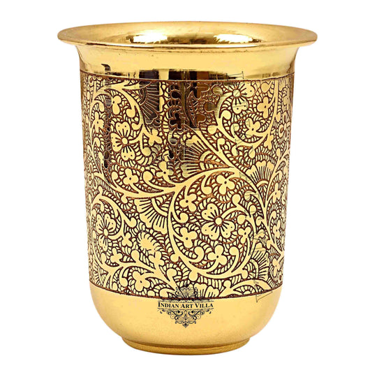 Curved brass glass with embossed design perfect for serving beverages at festive gatherings bringing style to your table
