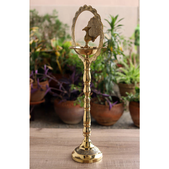 Indian Art Villa brass peacock diya stand with intricate design, perfect for traditional pooja and home decor.