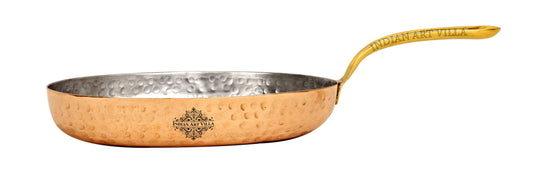 Handcrafted copper pan with brass handle and tin-lined interior helps to cook food evenly and efficiently.