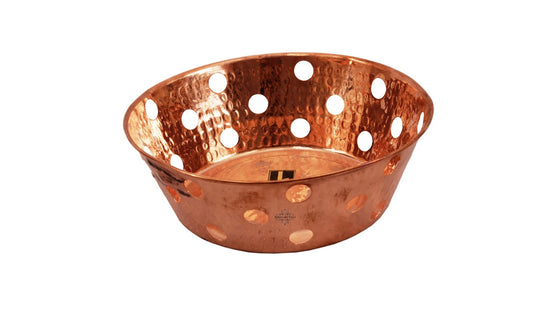 Handcrafted perforated copper bread basket by hammered design, ideal for serving bread, fruits