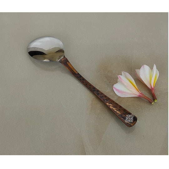 Copper cutlery set featuring easy-to-grip handles for a smooth baby feeding experience